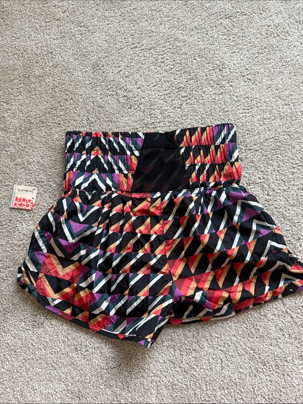 NWT Free people movement Orange crush combo print athletic shorts size Xs